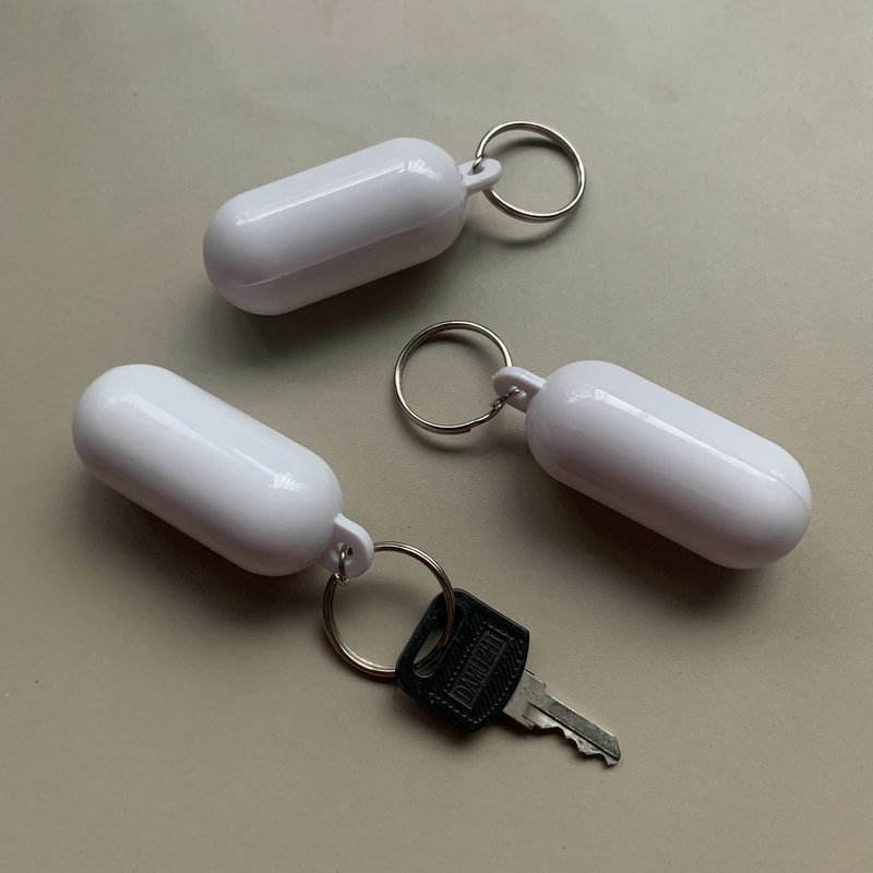 Custom Logo Floating Plastic Eco-friendly Key Ring Capsule Style Cylindrical Buoyant Keychain Swimming Pool Marine Sailing Boat