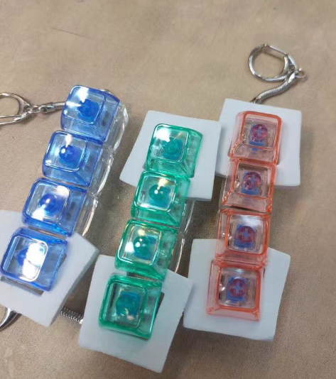 Novacross Plastic Squeezable Stress Relieving Toy Mechanical Keyboard Switch Creative Key Chain with Led Light Unisex